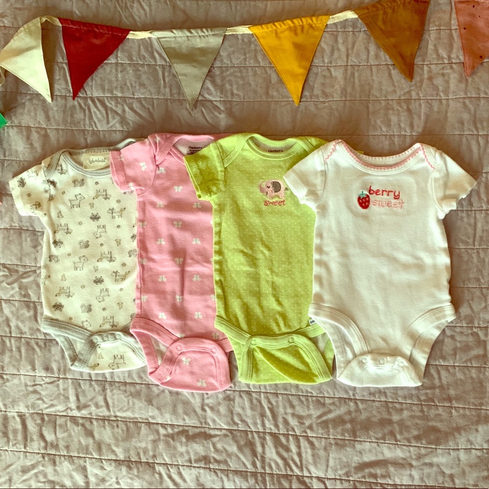 SOLD 4 short-sleeve onesies 0-3 months